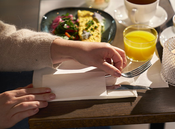 Convenient white linen feel napkin pocket preloaded with cutlery